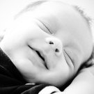 Black and white portrait of a two month old baby boy.